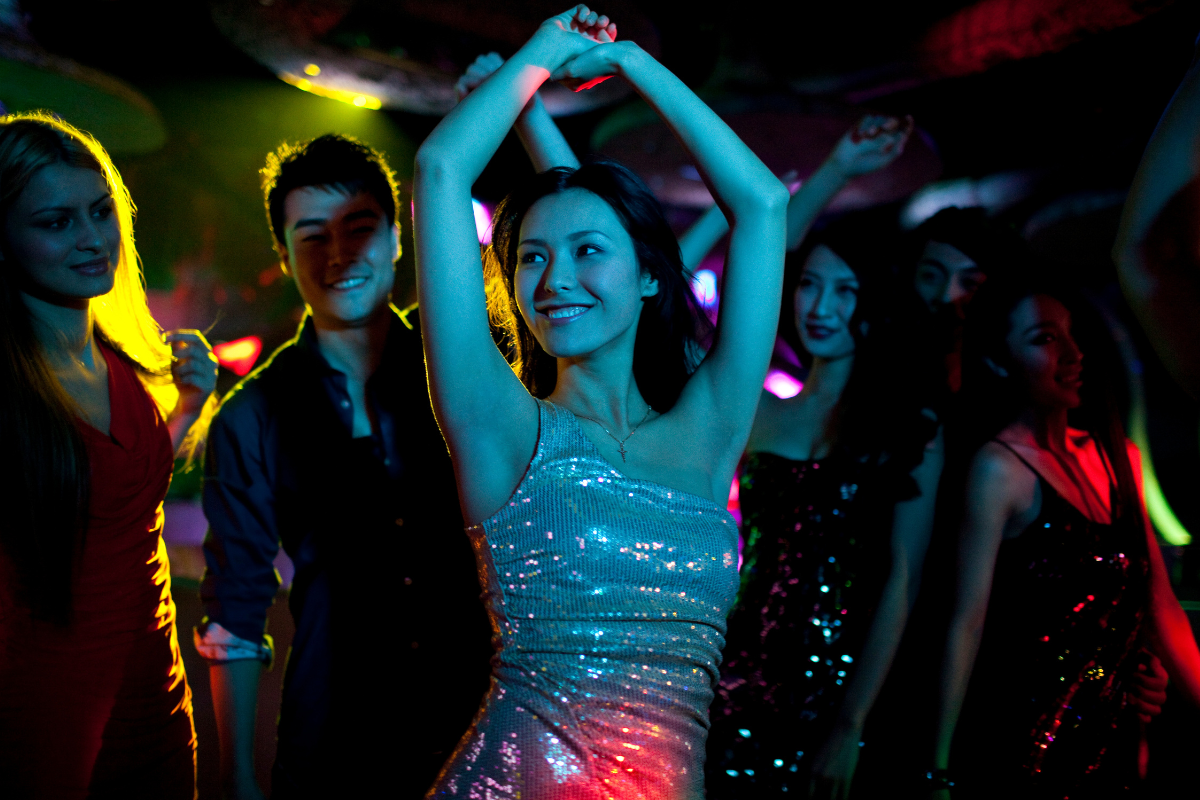 stylish young people dancing in prom night
