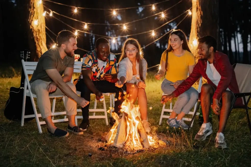 teenagers enjoying bonfire party in poconos
