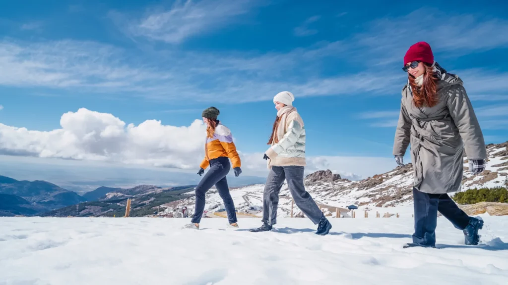 people are walking in the snow poconos